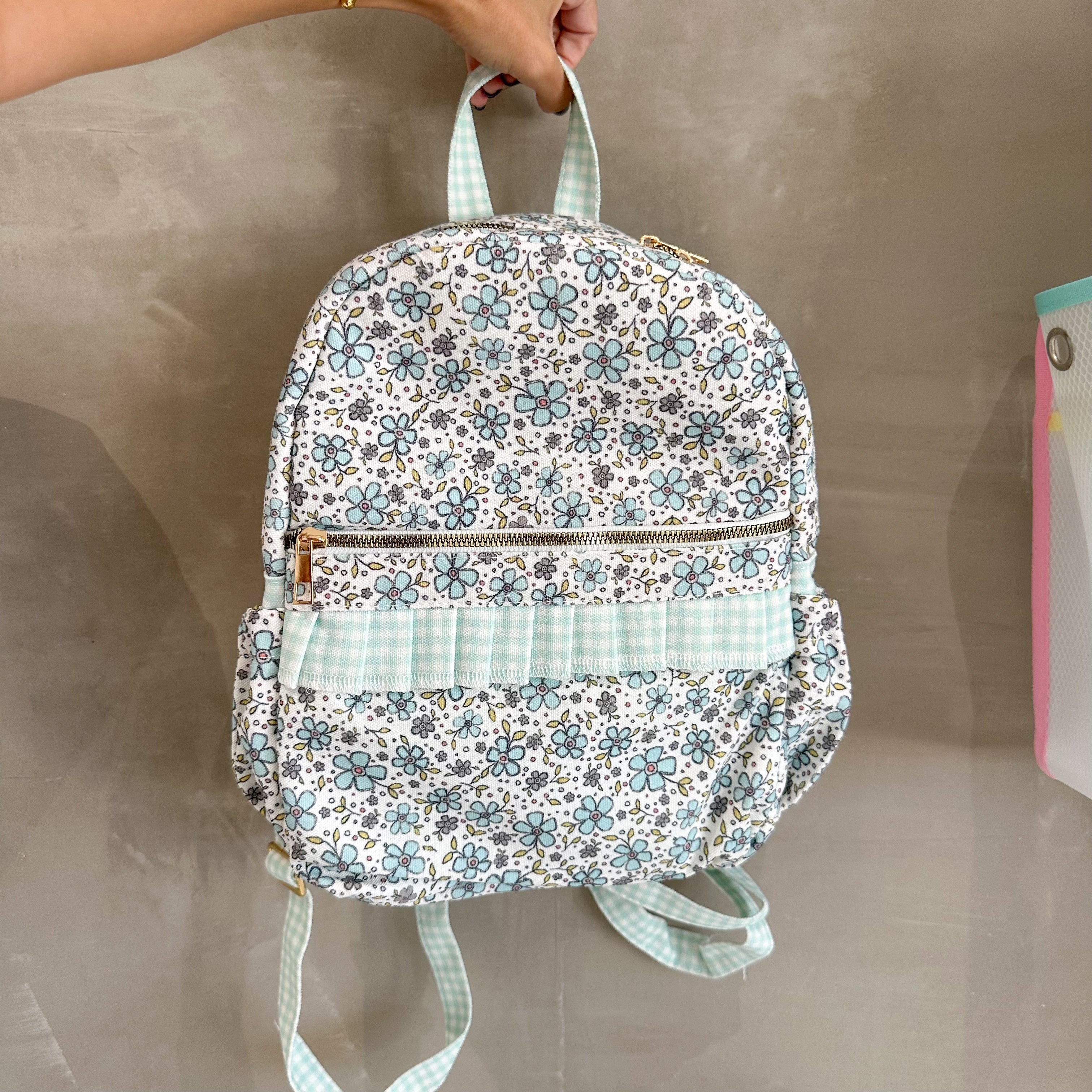TURQUOISE FLORAL RUFFLE BACKPACK