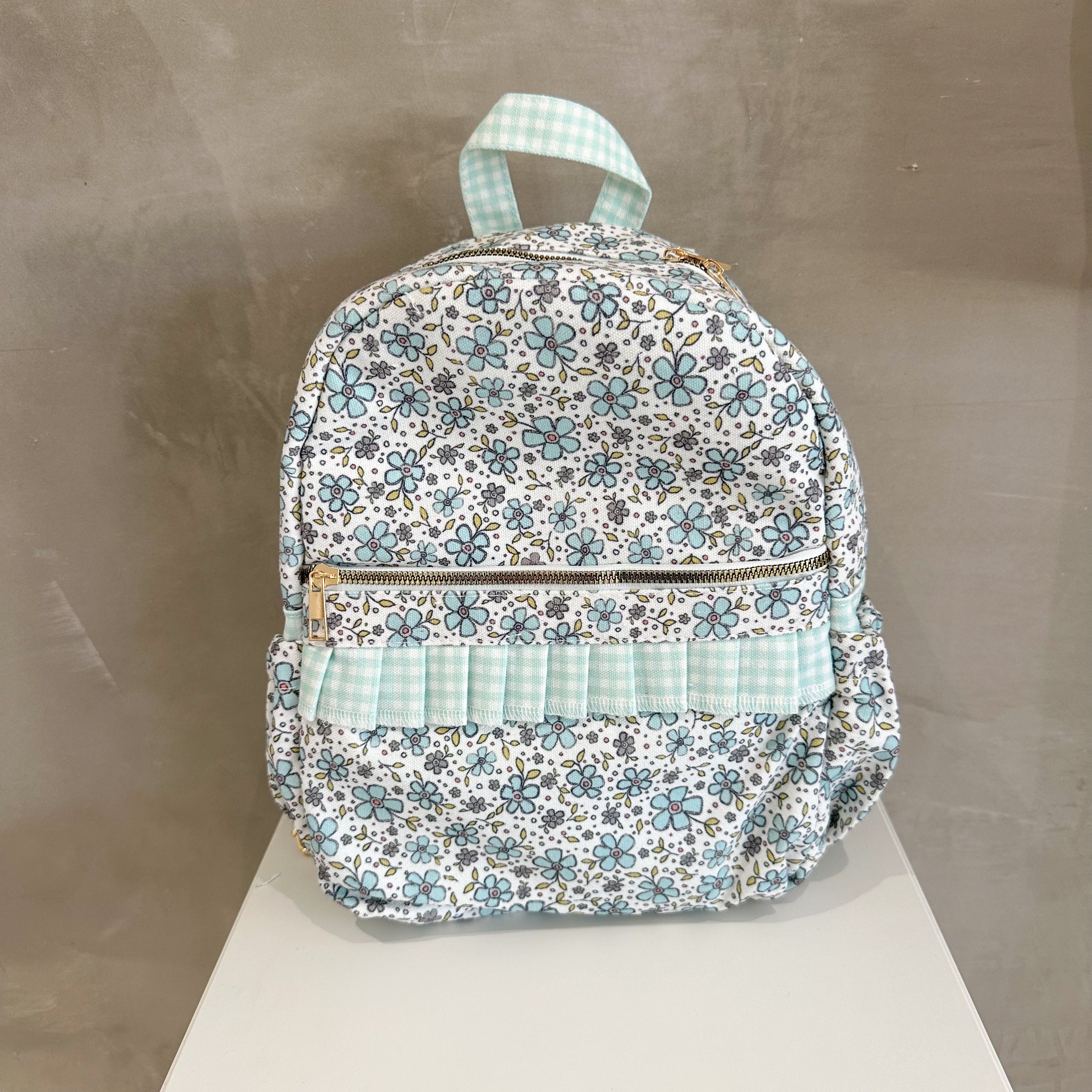 TURQUOISE FLORAL RUFFLE BACKPACK